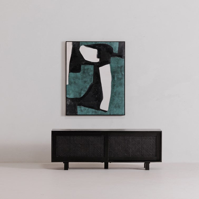 Abstract painting above a minimalist black console.