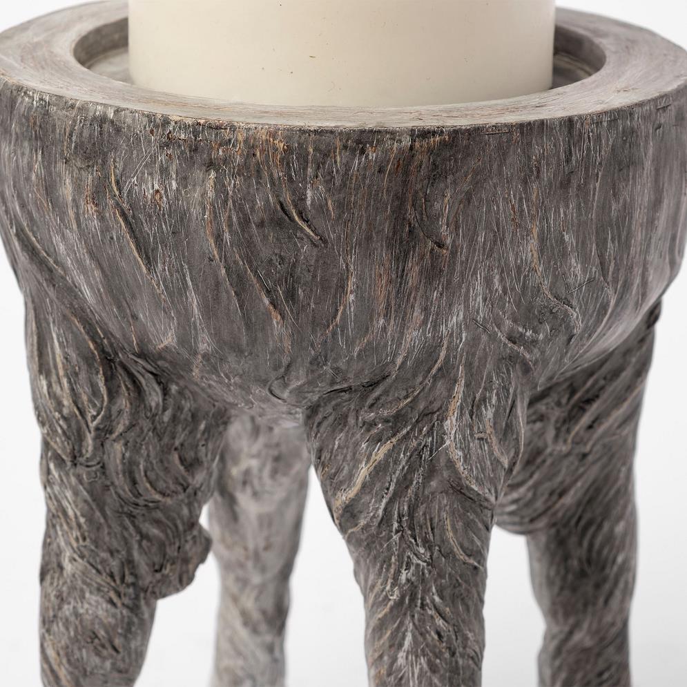 Wooden-textured candle holder with a white candle.