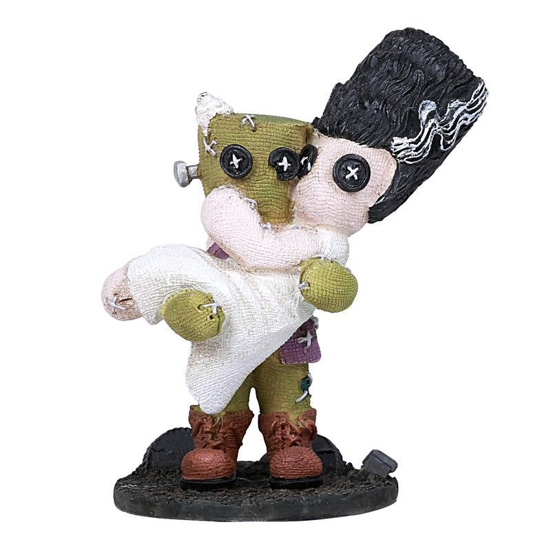 Monster couple figurine embracing, made of fabric and buttons.