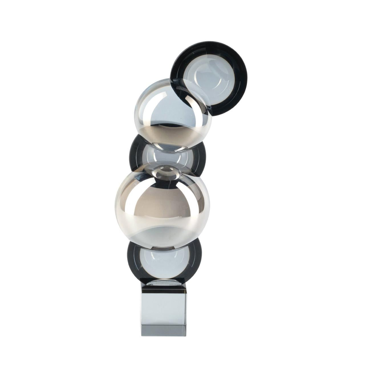 Abstract sculpture of stacked transparent spheres.