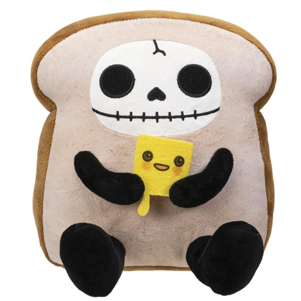 Plush bread-shaped creature with a skull face holding a yellow slice.