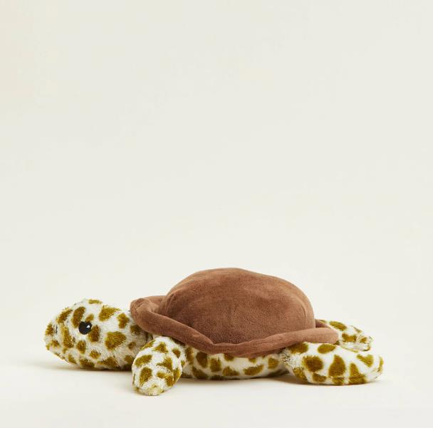 Plush turtle toy with a brown shell on a plain background.