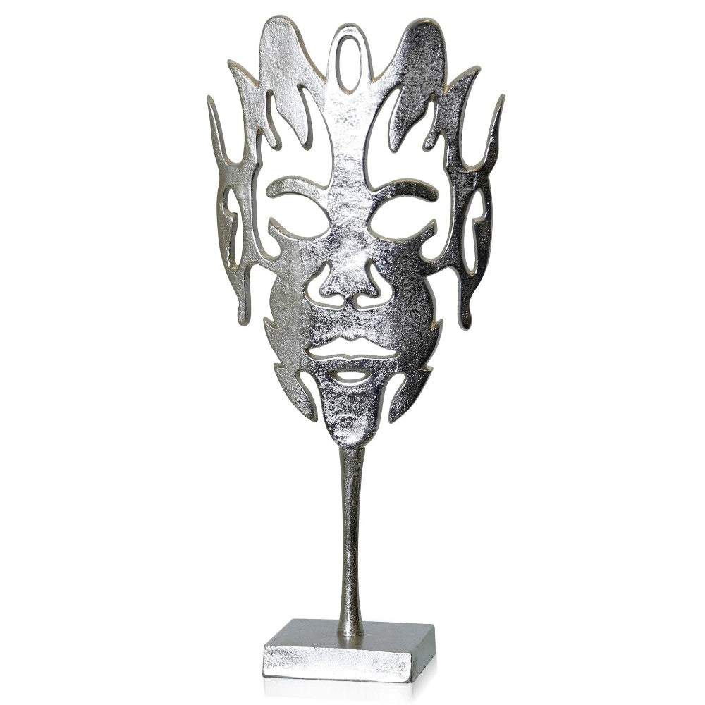 Silver abstract face sculpture on a stand.