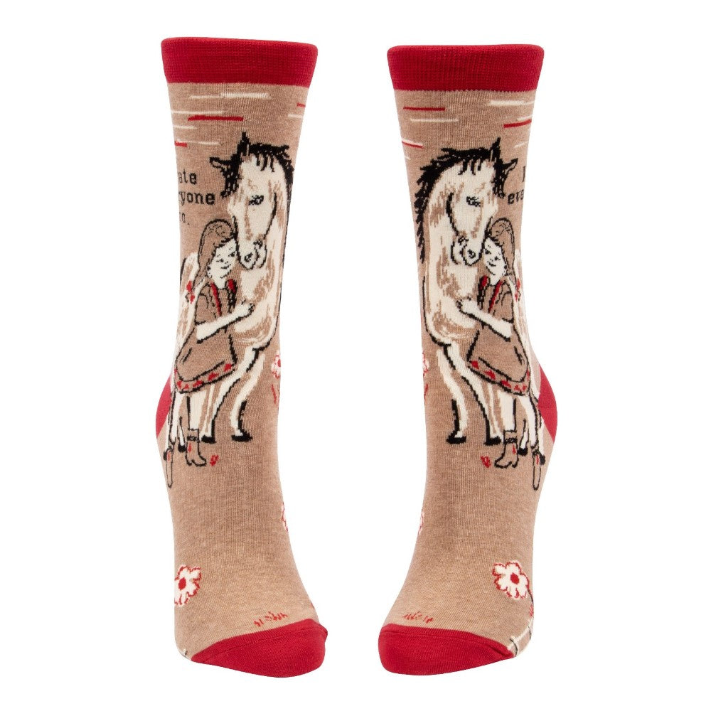 Beige socks with red accents, featuring a girl hugging a horse.