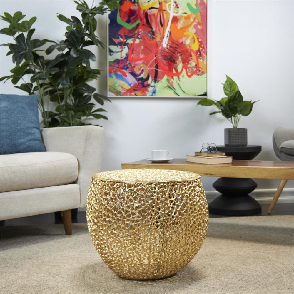 Stylish living room with abstract art and gold-accented wicker table.