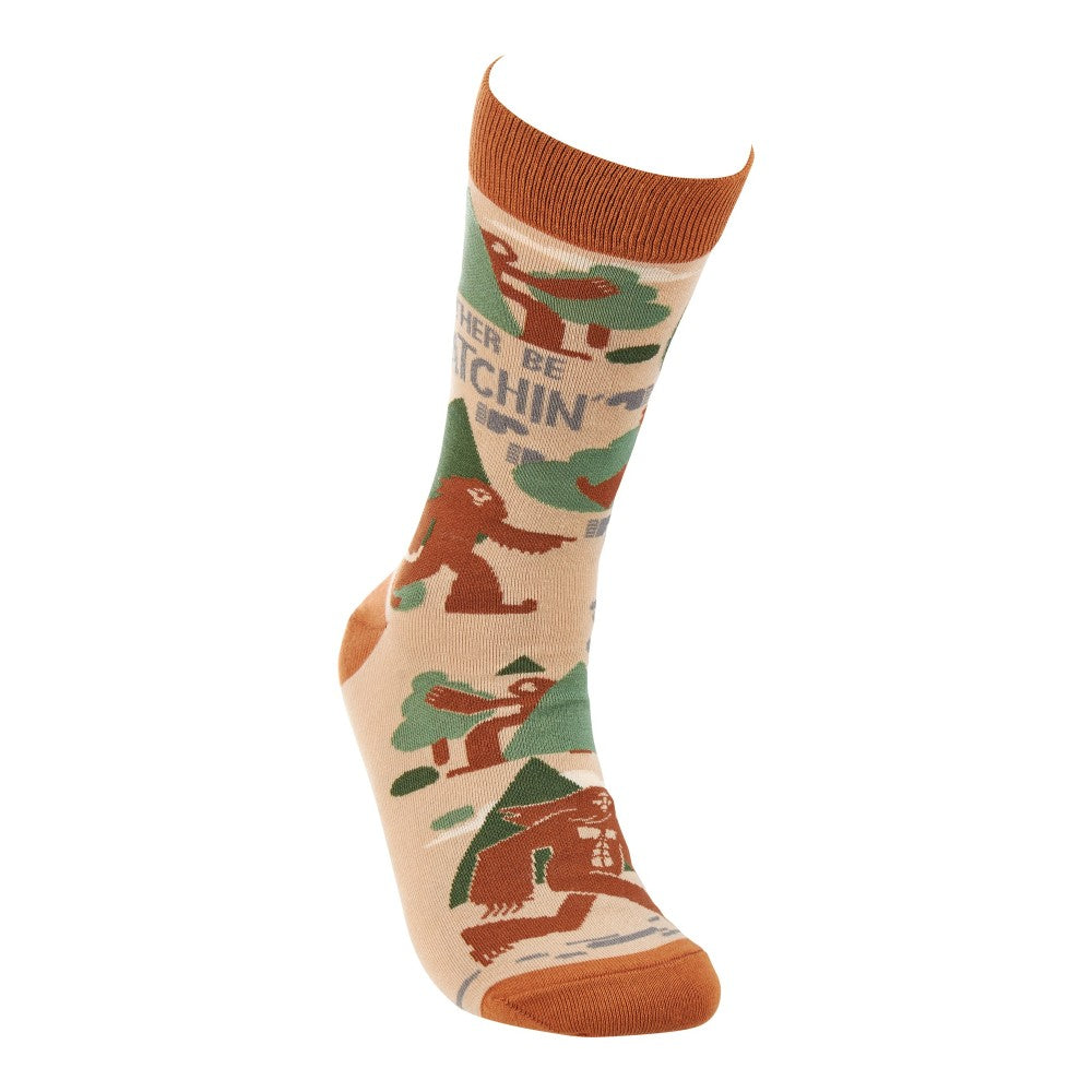 Beige sock with Bigfoot and trees, orange accents.