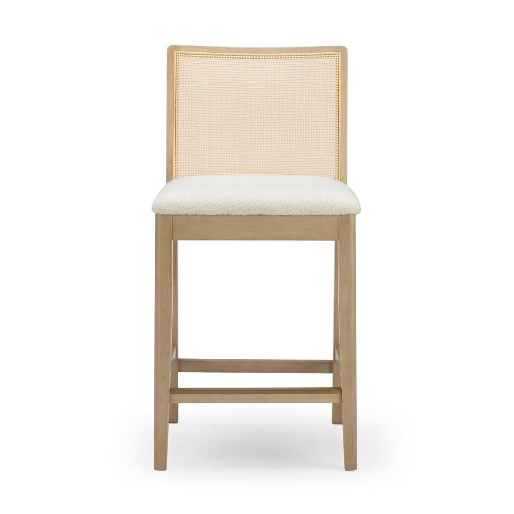 Wooden bar stool with a cushioned seat and woven backrest.