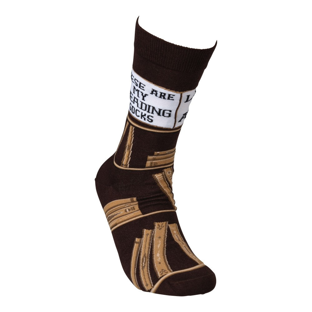 Brown socks with book design and "reading socks" text.