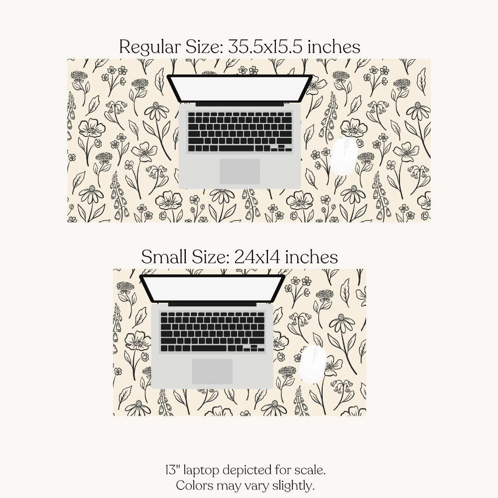 Floral desk mats in regular and small sizes with a laptop for scale.