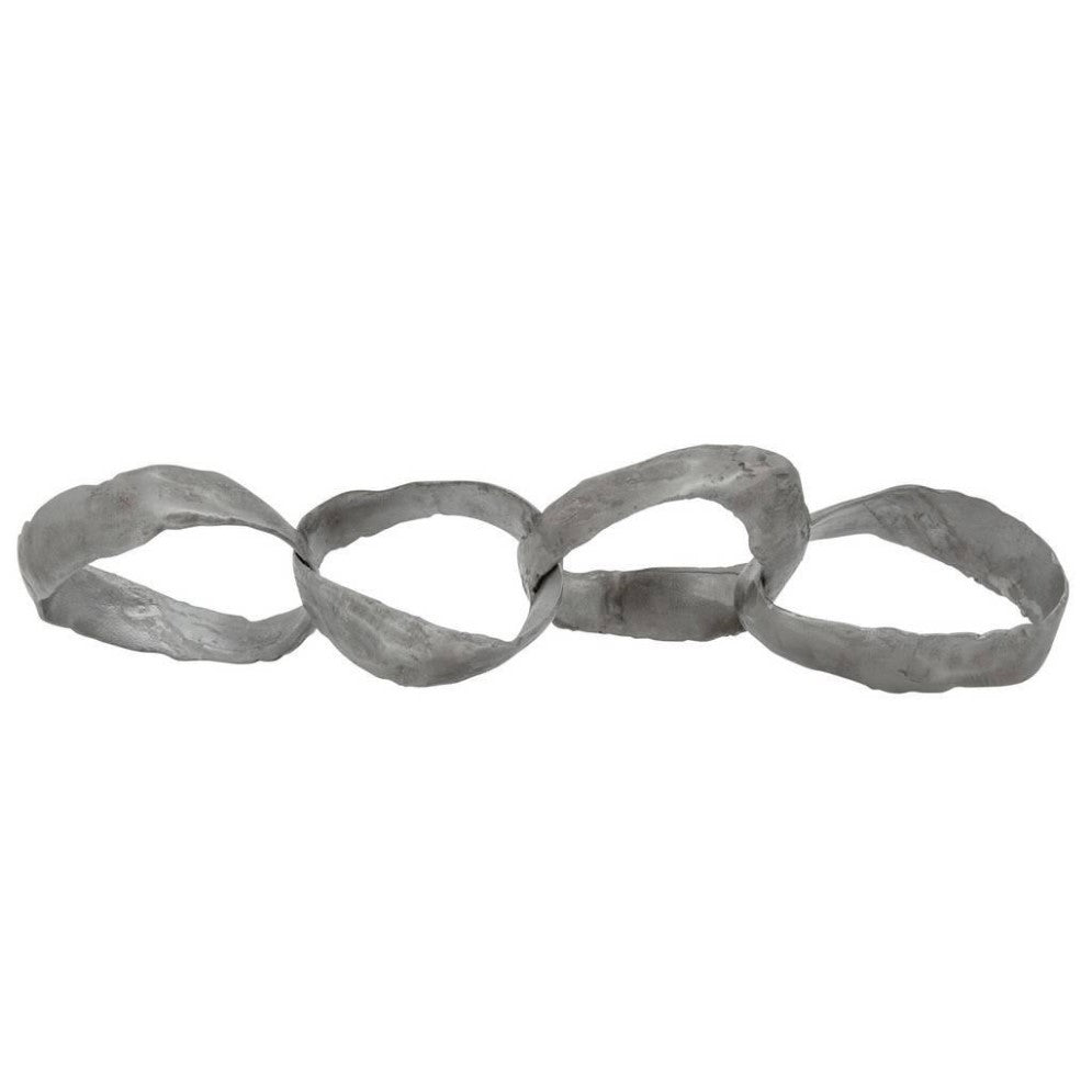 Four linked, textured metal loops on a white background.
