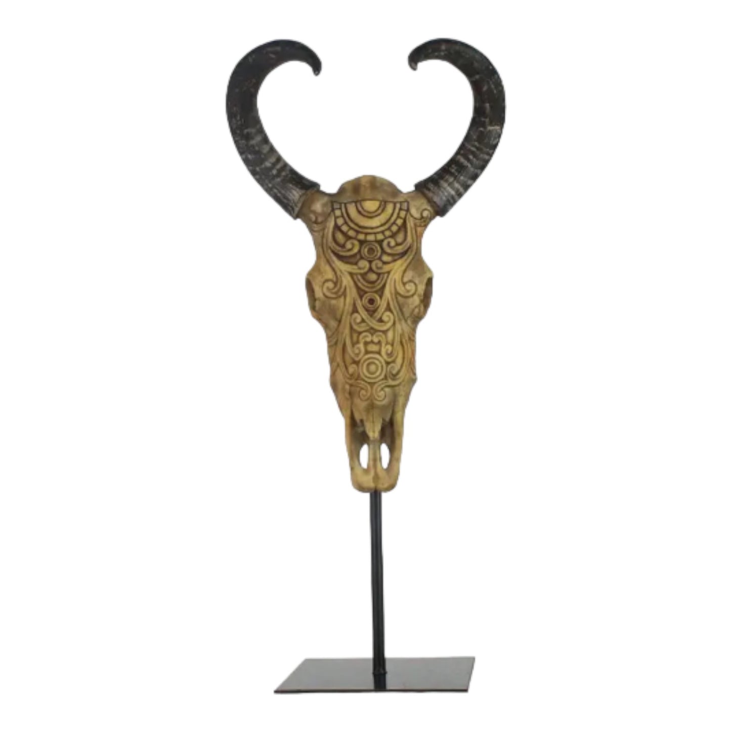 Intricately carved skull with dark curved horns on a stand.