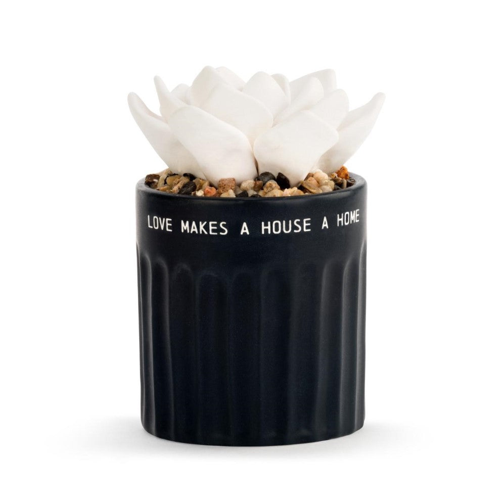 Black pot with white flower and text: "LOVE MAKES A HOUSE A HOME."