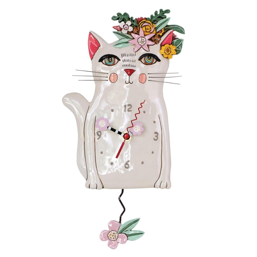 Ceramic cat wall clock with floral design.