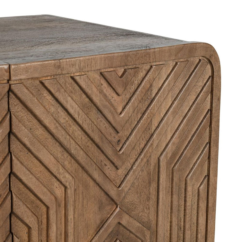 Wooden corner with carved geometric patterns.
