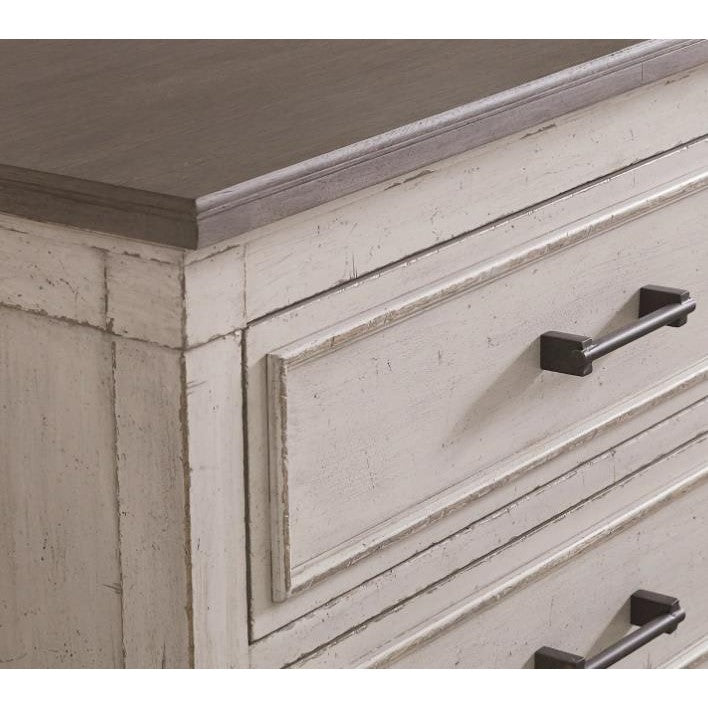 Vintage-style dresser with dark handles.
