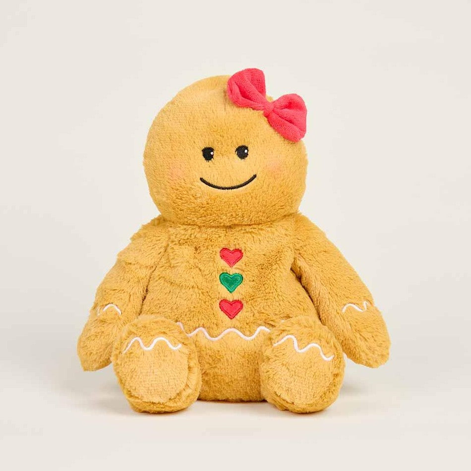 Plush gingerbread doll with a pink bow and heart buttons.
