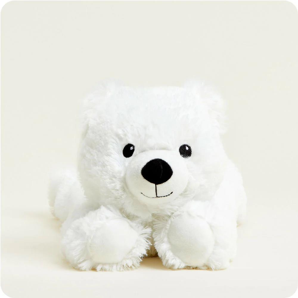 Fluffy white polar bear plush toy with a cute face.