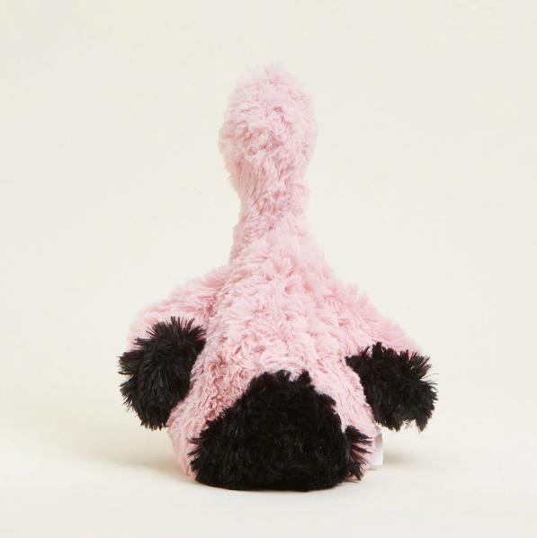 Fluffy pink stuffed animal with black accents, viewed from behind.