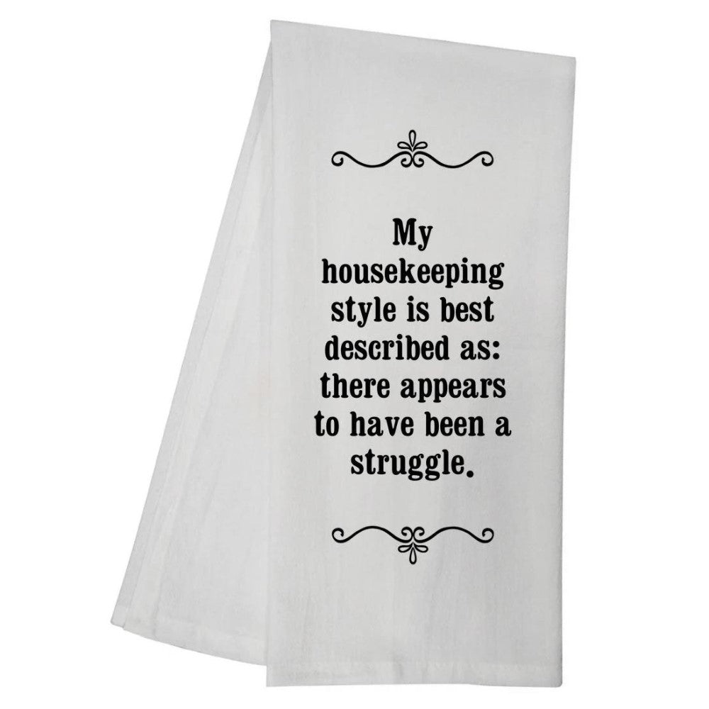White cloth with humorous text about messy housekeeping.