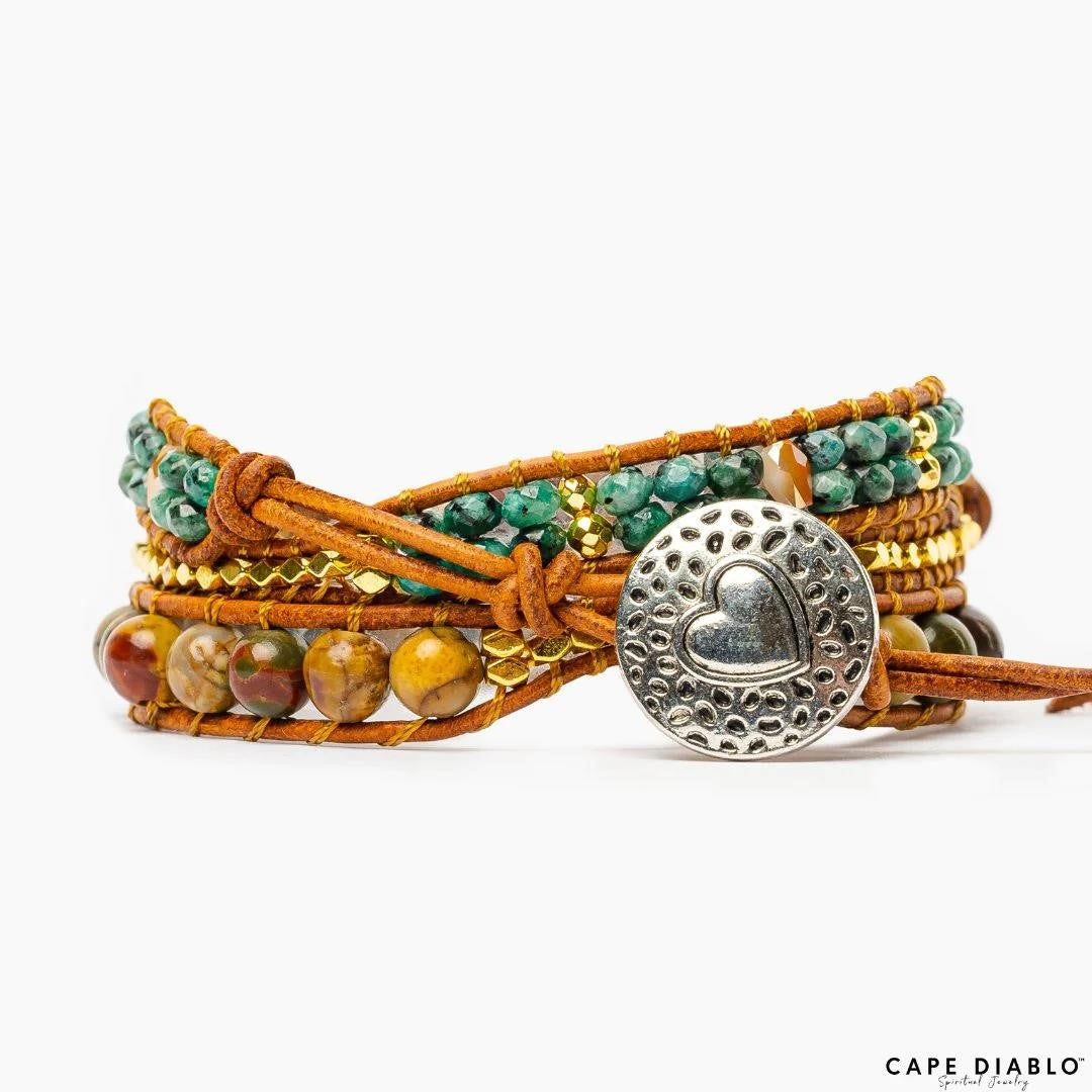 Colorful beaded bracelet with heart design clasp on leather cord.