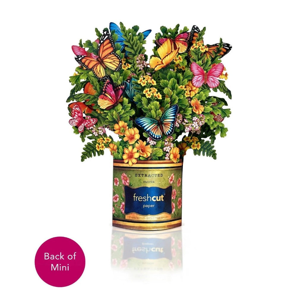 Colorful butterflies and flowers in a can, labeled "freshcut paper."