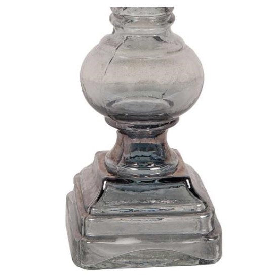 Ornate glass candlestick base on a square pedestal.