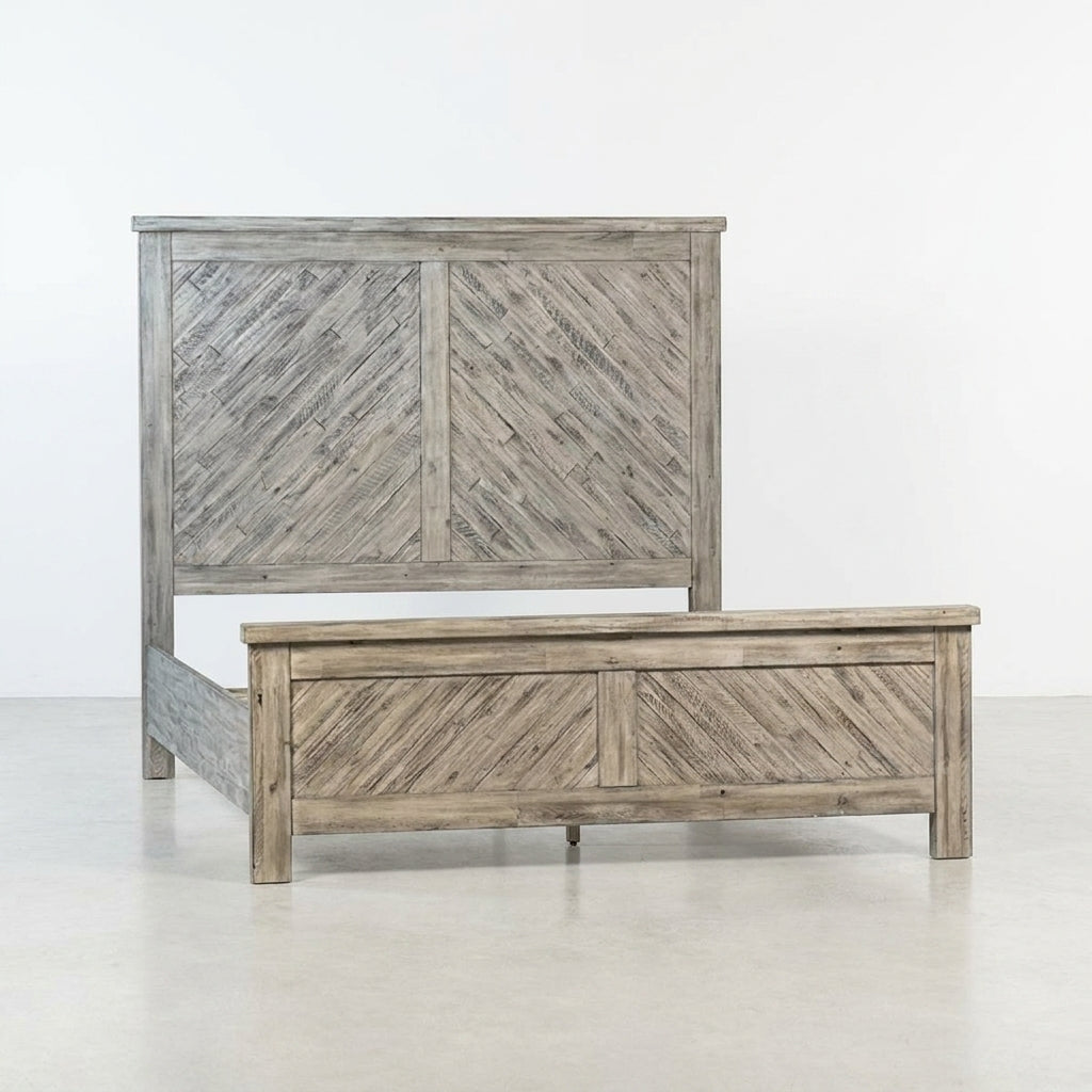 Rustic wooden bed frame with herringbone design.