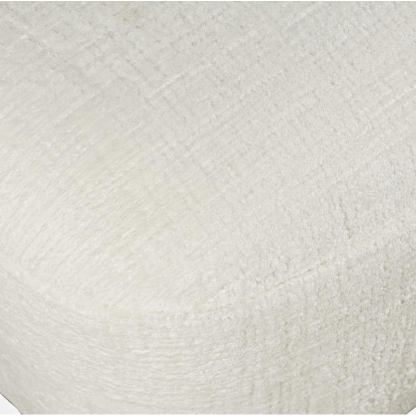 Close-up of a textured white fabric surface.
