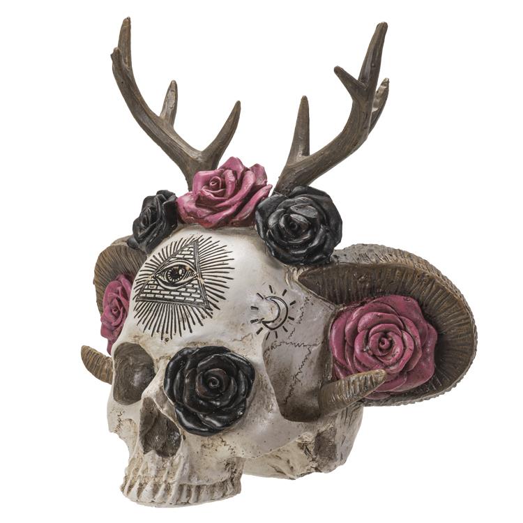 Decorative skull with antlers, roses, and symbolic designs.