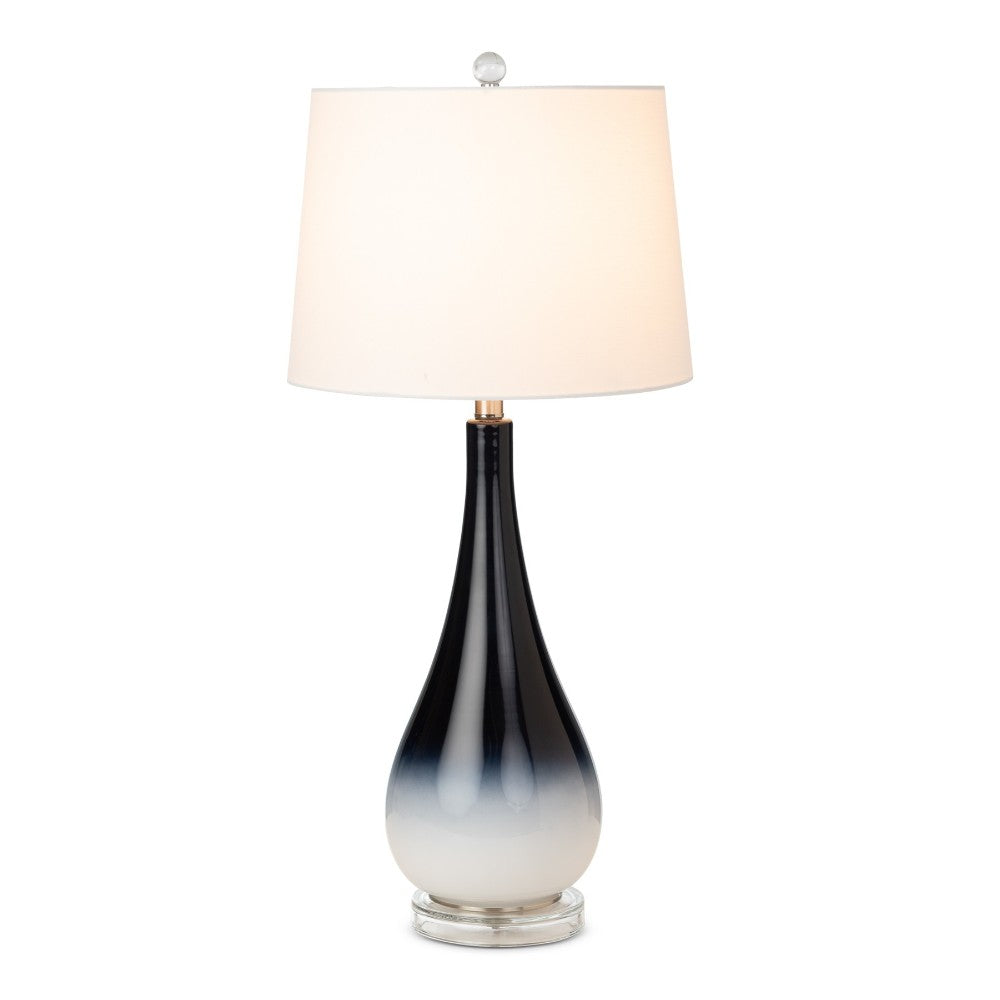 Elegant lamp with gradient black to white base and white shade.