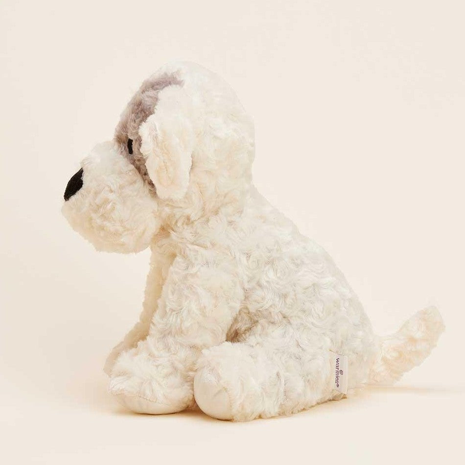 Fluffy white and gray plush puppy sitting side-on.