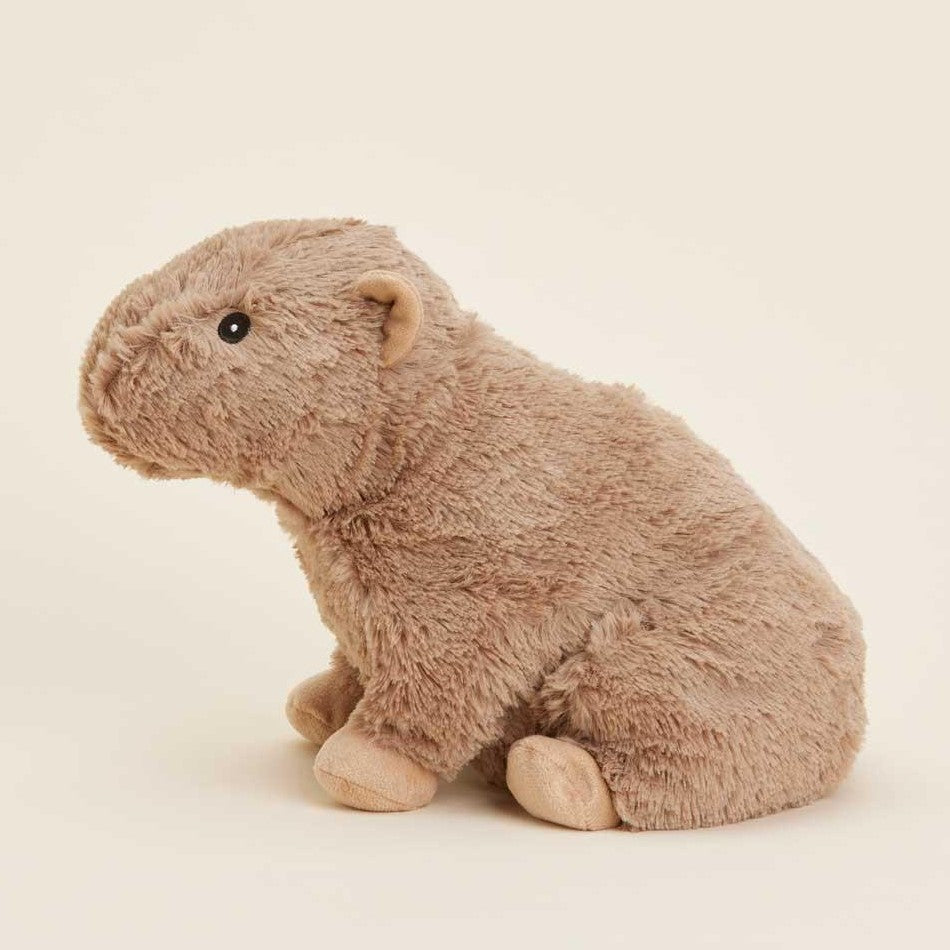 Fluffy capybara plush toy on a plain background.
