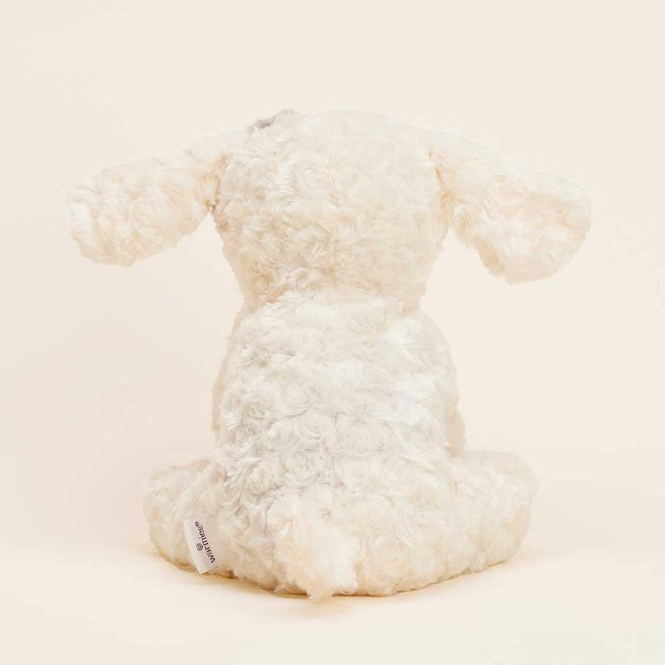 Fluffy stuffed animal sitting, back view.