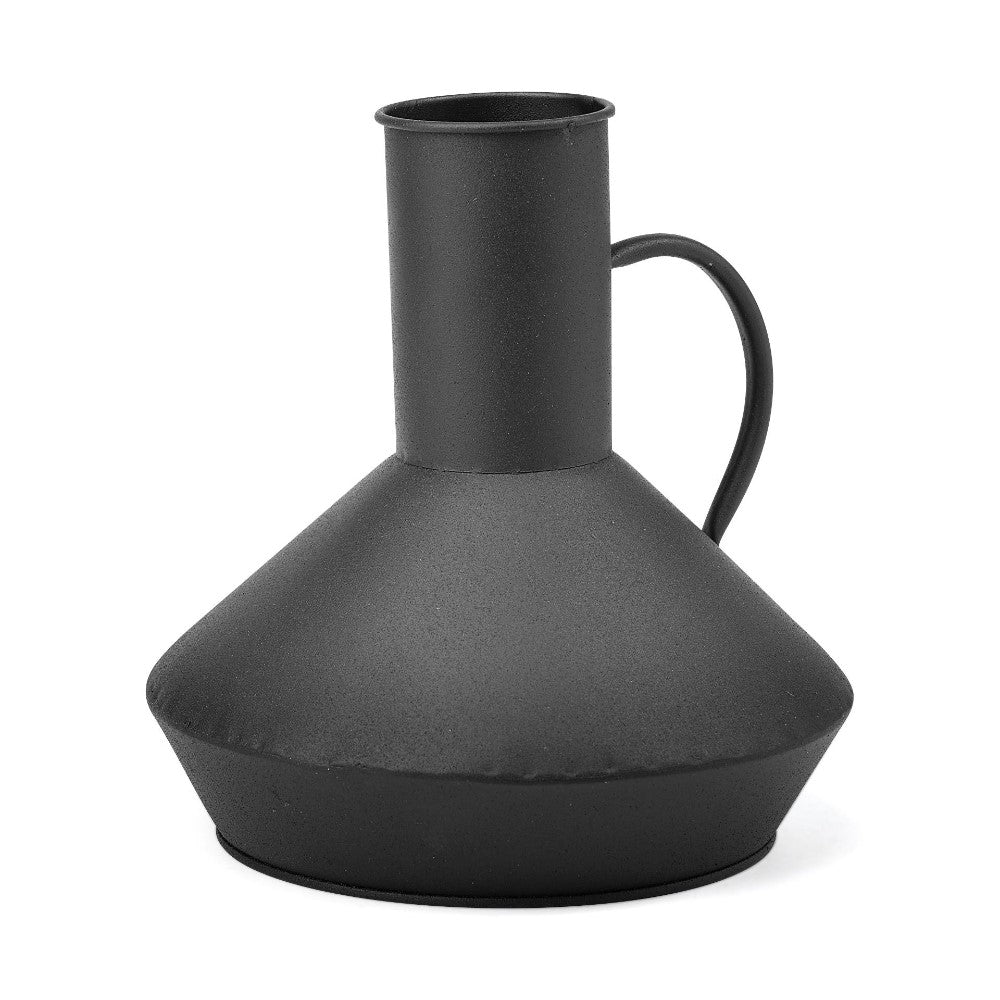 Black metallic jug with a round handle and wide base.