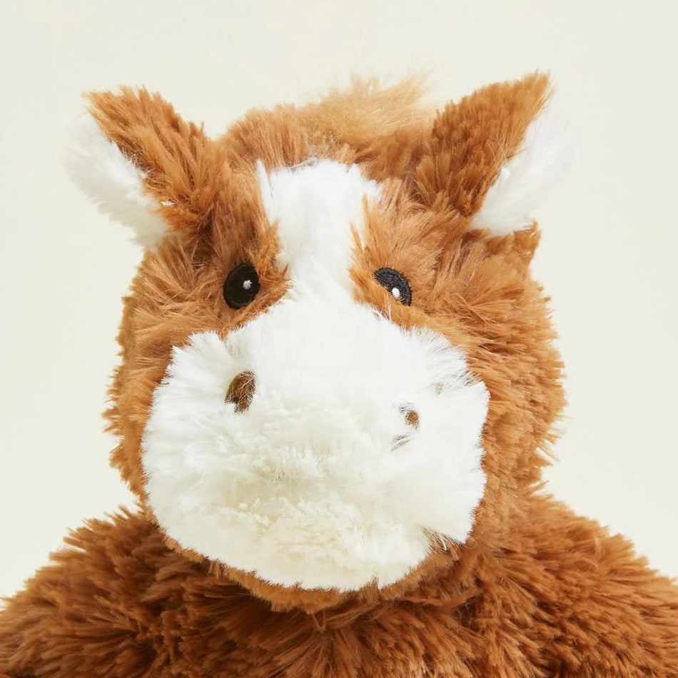 Fluffy stuffed animal with brown and white fur.