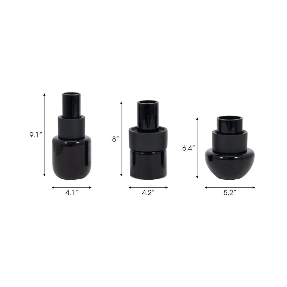 Three black vases with varying heights and widths.