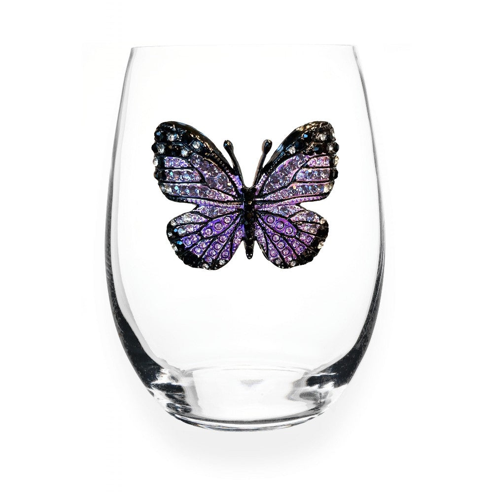 Glass with a decorative purple and black butterfly.