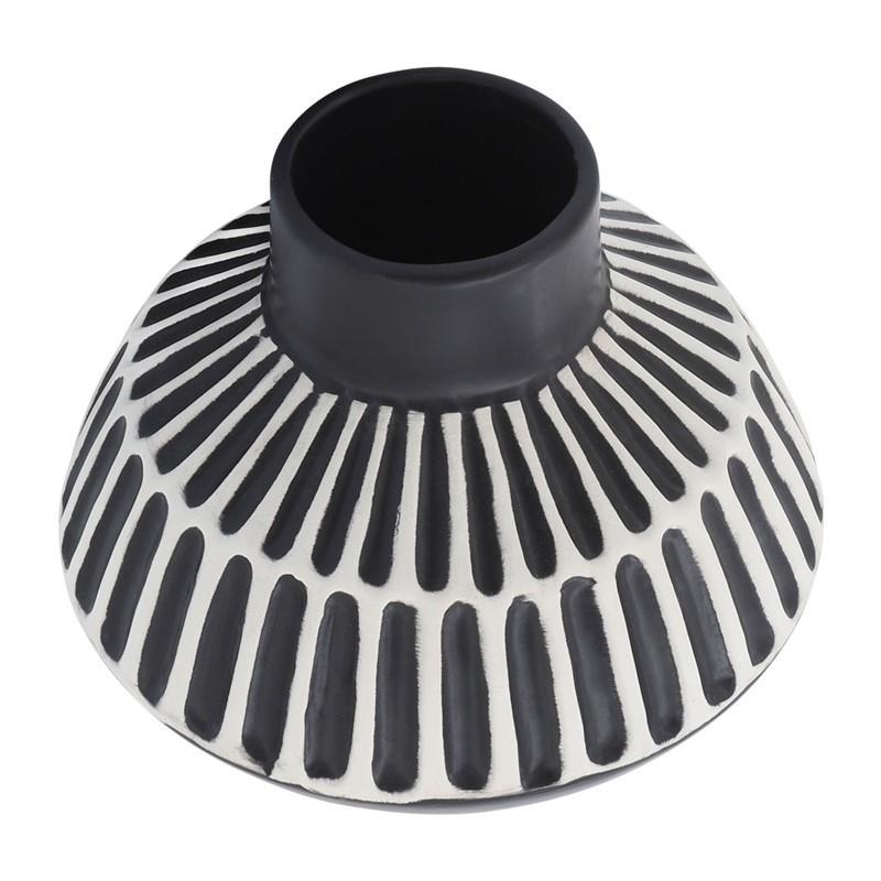 Black and white striped vase, top view.