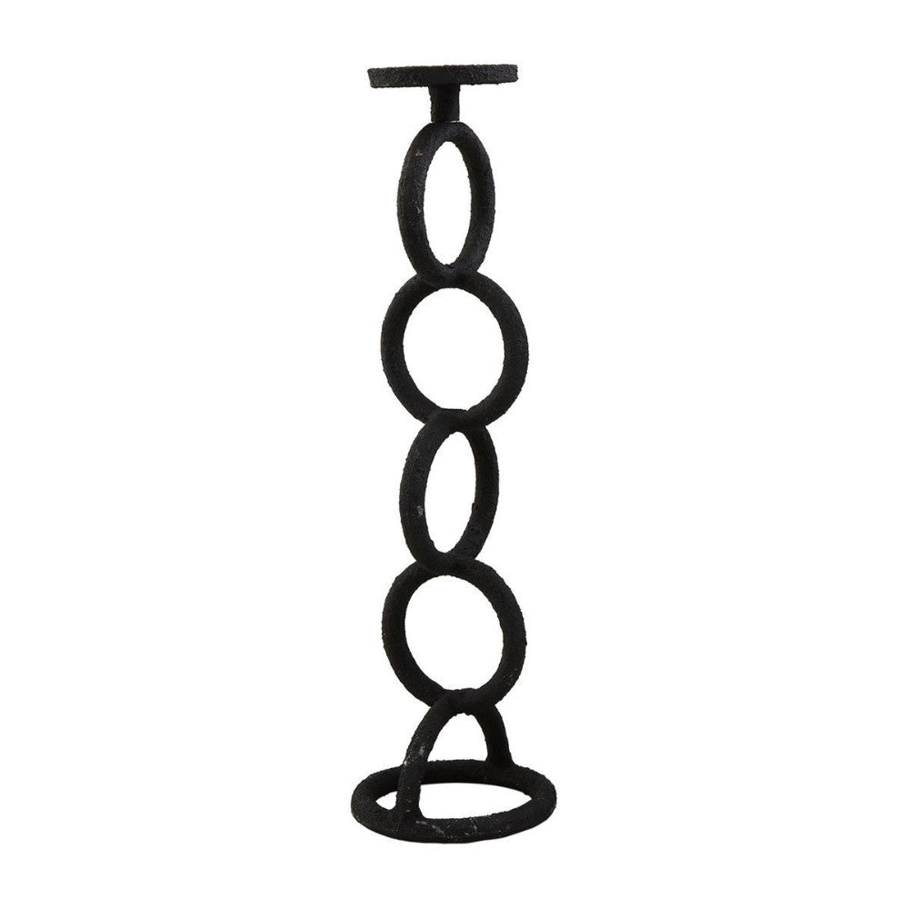 Black candle holder with stacked circular design.