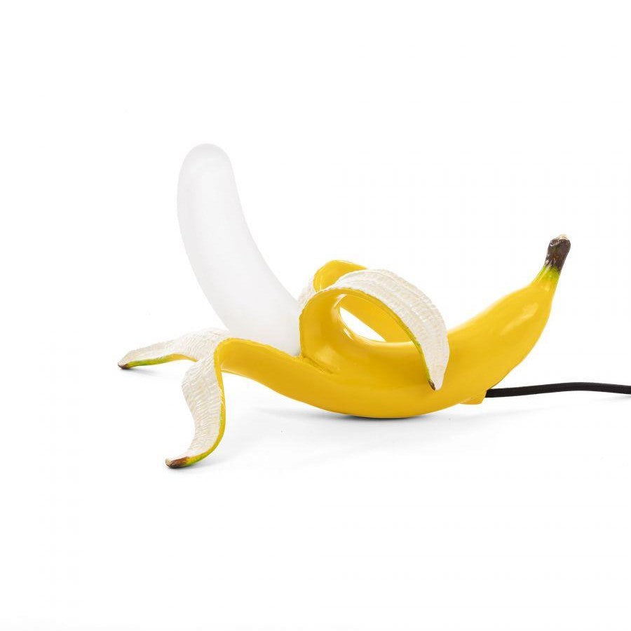 A banana-shaped lamp with a peeled design.