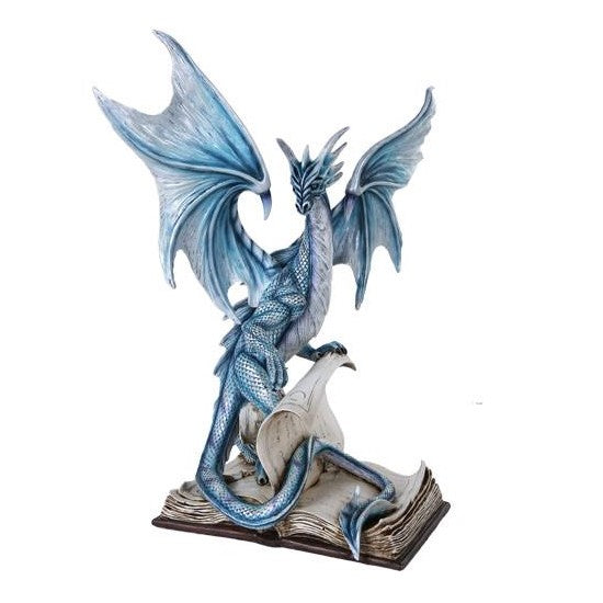 Blue dragon poised on books, wings spread.