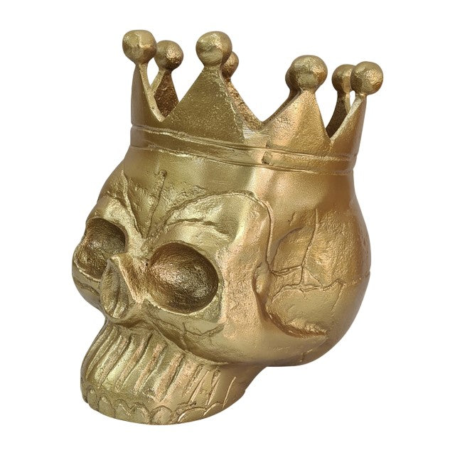 Golden skull with a crown, facing left.