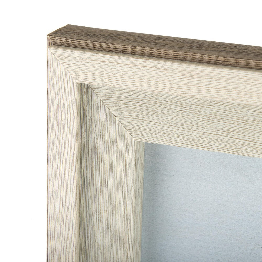 Close-up of a textured, light wooden picture frame corner.