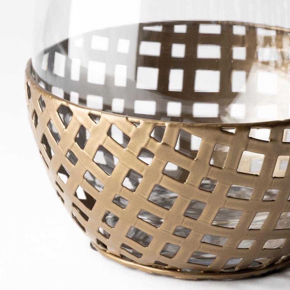 Transparent bowl with a lattice metal base.