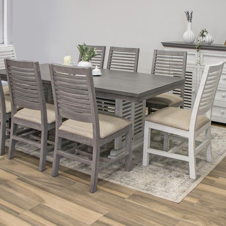 Gray dining set with slatted chairs on a wooden floor.