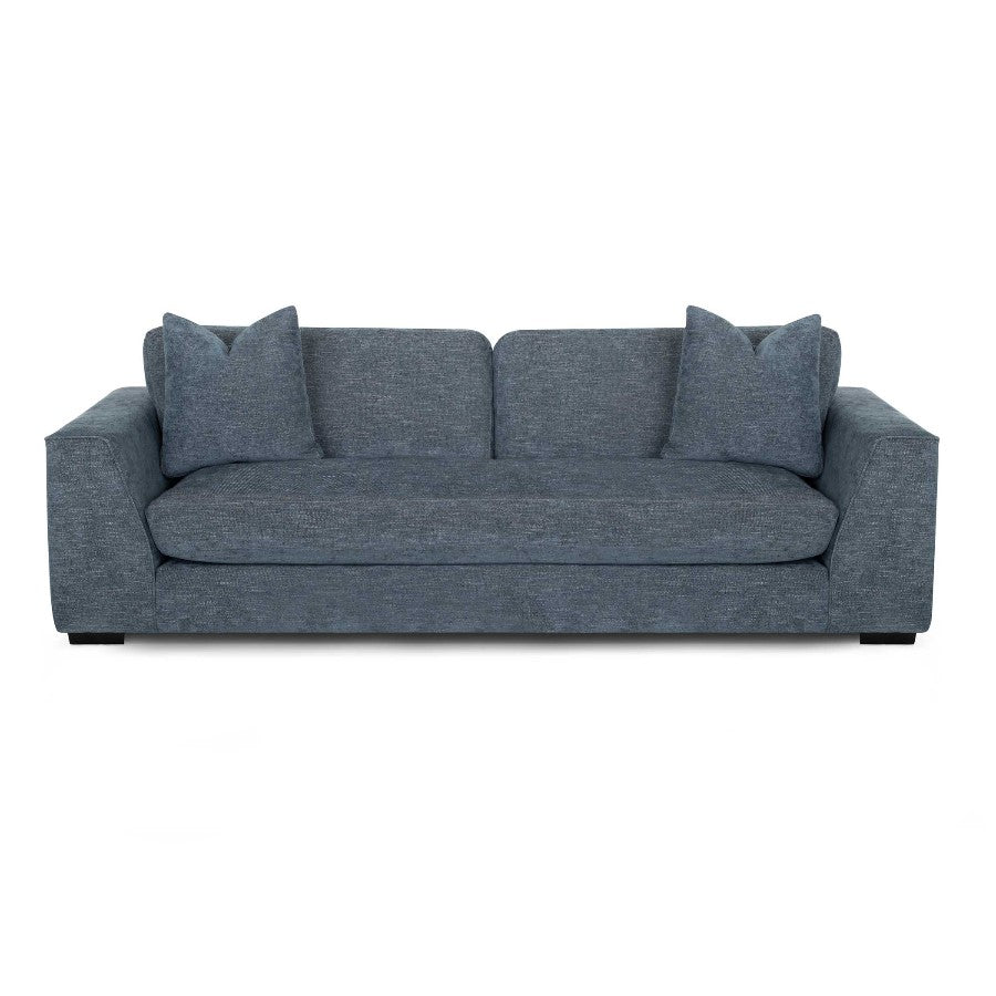 Modern blue sofa with two matching cushions.