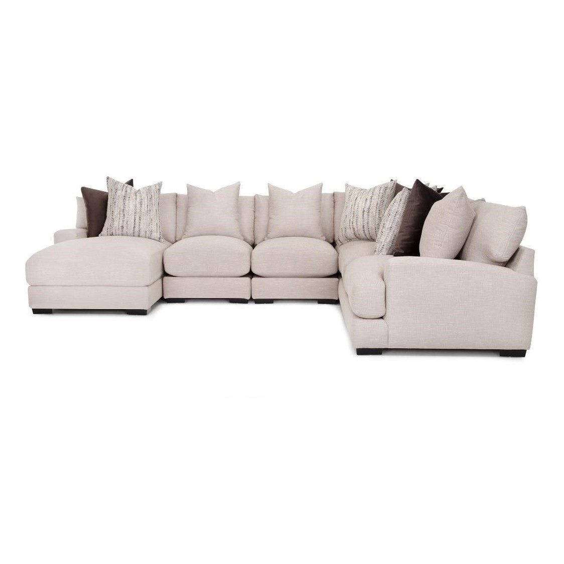 L-shaped beige sectional sofa with assorted pillows.