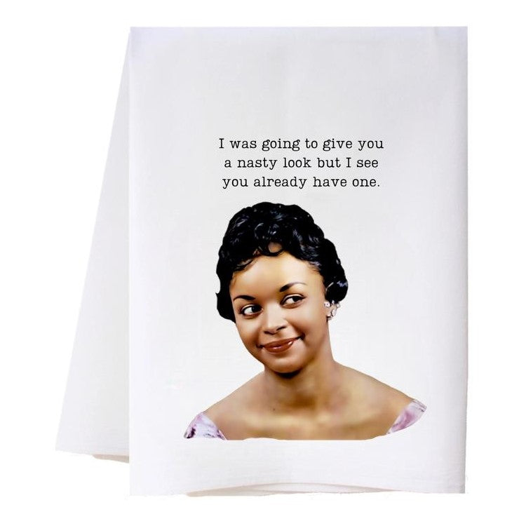 Smirking woman with a humorous caption on a towel: "nasty look" joke.
