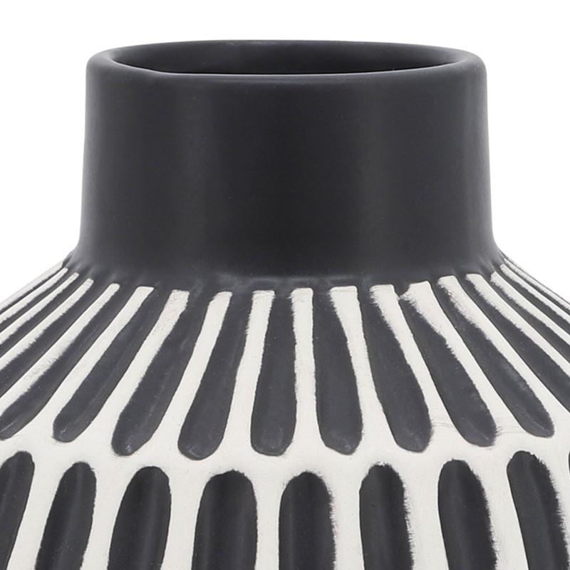 Black and white vase with vertical stripe pattern.