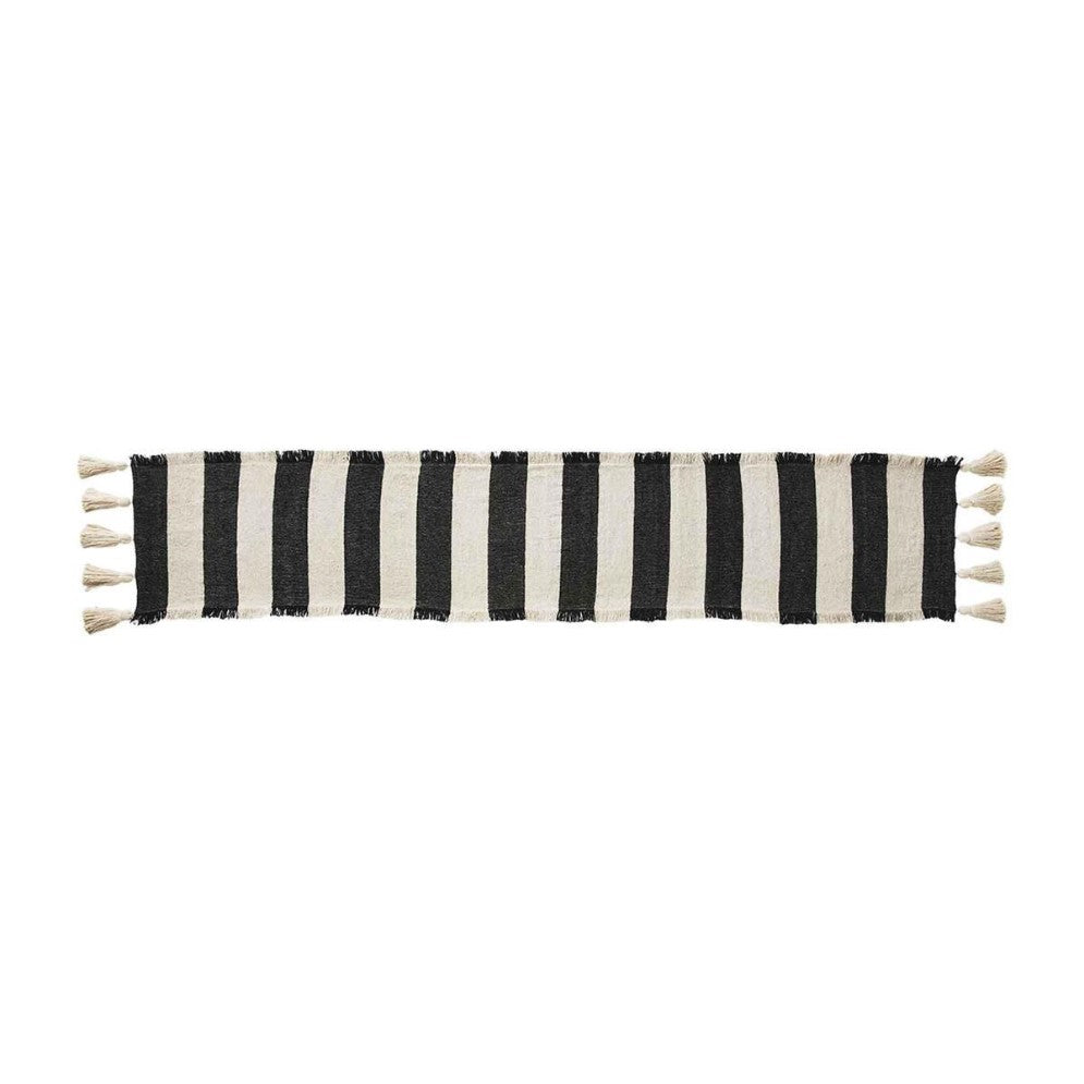 Black and white striped table runner with tassels.
